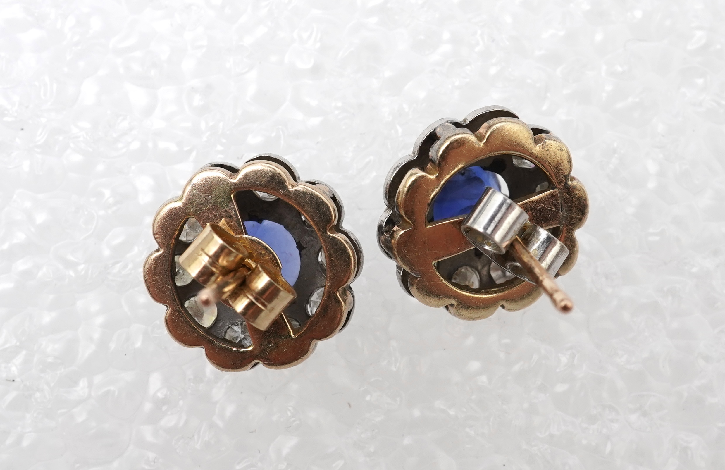 A pair of sapphire and diamond studs, mid 20th century
